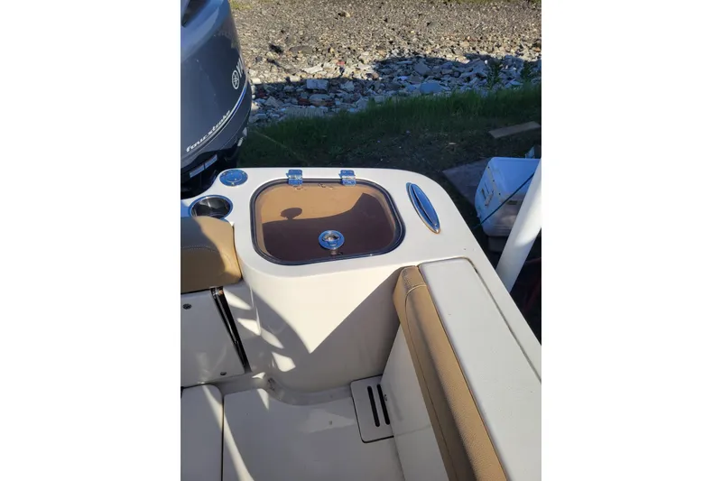 Slide: The Image of 2020 Scout 255 Dorado boat interior with seating and storage compartment. - 22