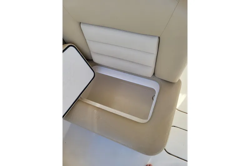 Slide: The Image of Scout 255 Dorado 2020 boat seat with open storage compartment. - 25