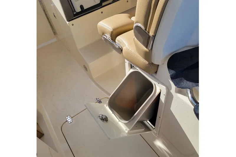 Slide: The Image of 2020 Scout 255 Dorado boat interior with built-in storage compartment and seating. - 26