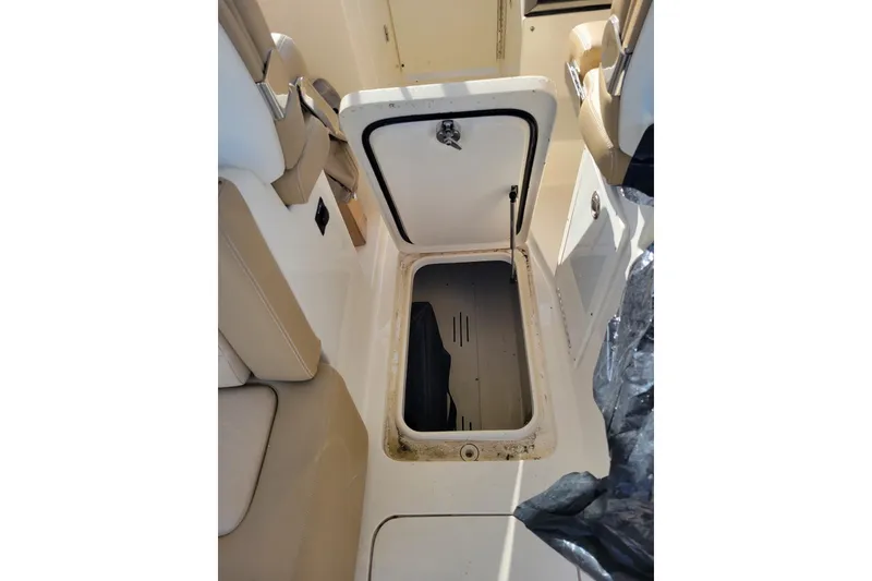 Slide: The Image of Open storage compartment on 2020 Scout 255 Dorado boat, showcasing interior space. - 27