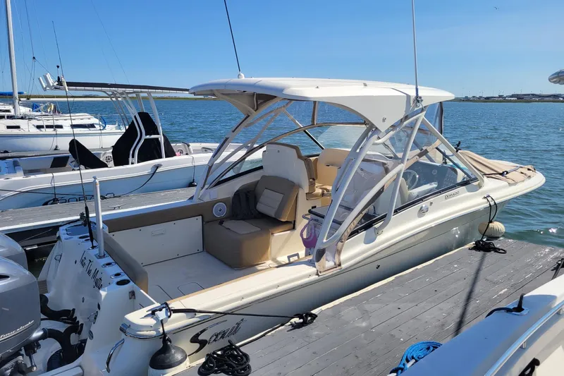Slide: The Image of 2020 Scout 255 Dorado boat docked at marina on a sunny day. - 3