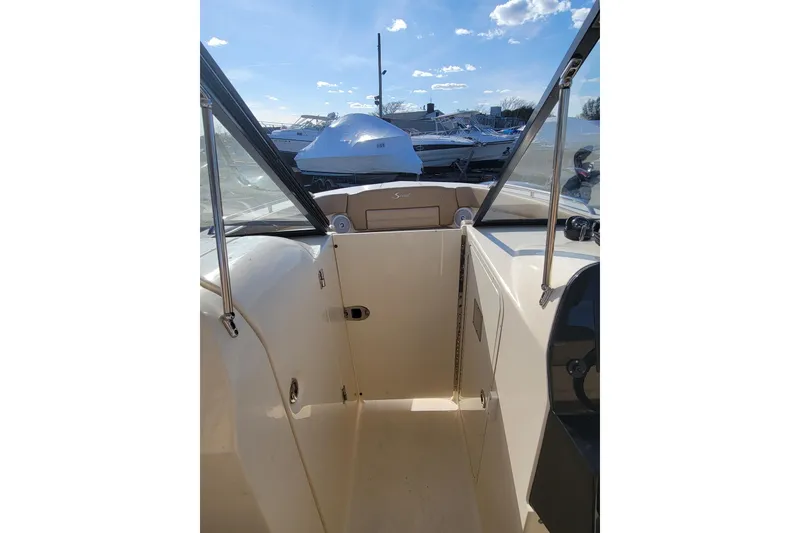 Slide: The Image of 2020 Scout 255 Dorado boat interior with open deck and clear sky view. - 33