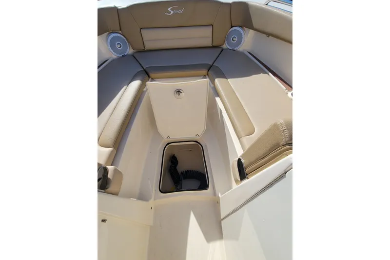 Slide: The Image of Interior view of 2020 Scout 255 Dorado boat with beige seating and storage compartment. - 34