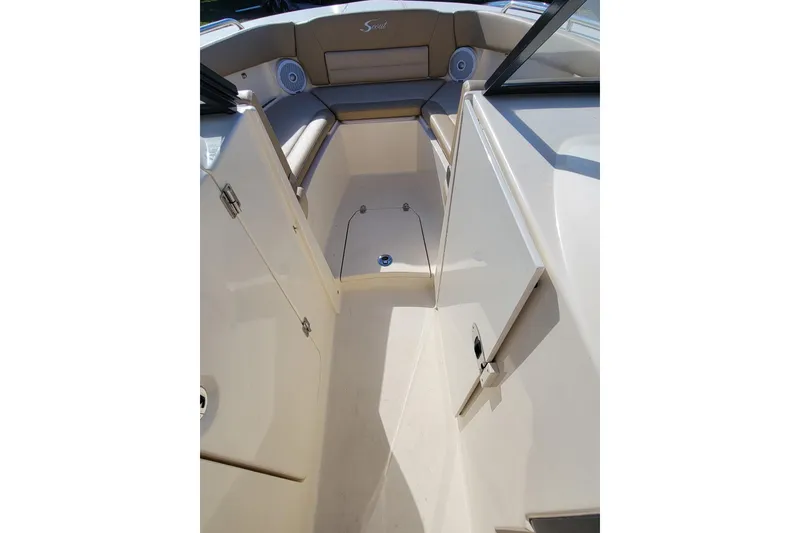 Slide: The Image of Interior view of 2020 Scout 255 Dorado boat, featuring seating and storage compartments. - 35