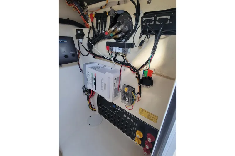Slide: The Image of Electrical panel and wiring inside a 2020 Scout 255 Dorado boat. - 36