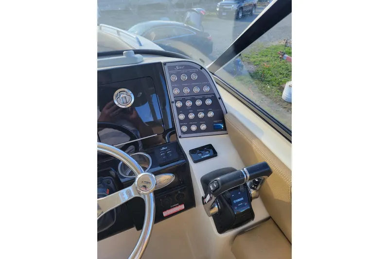 Slide: The Image of Helm of 2020 Scout 255 Dorado boat with steering wheel and control panel. - 37