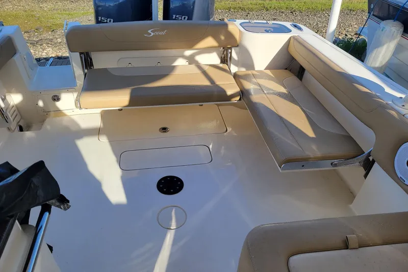 Slide: The Image of 2020 Scout 255 Dorado boat interior with beige seating and twin 150 engines. - 38