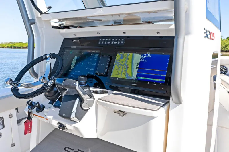 Slide: The Image of 2025 Solace 32 CS boat docked, showcasing sleek design and modern features. - 9