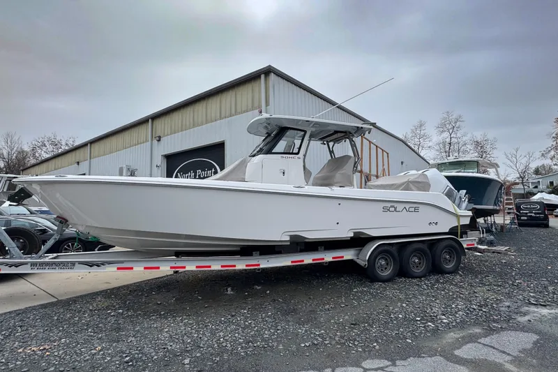 The Image of 2025 Solace 30 HCS boat on a trailer at North Point facility. - 1