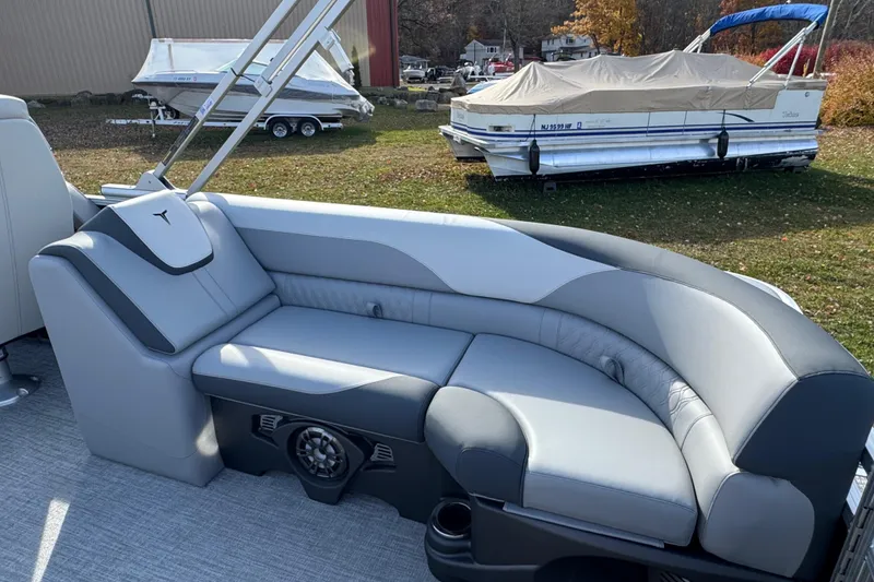 Slide: The Image of 2026 Tahoe Pontoon LTZ Quad Lounger 23 with sleek gray seating and modern design. - 10