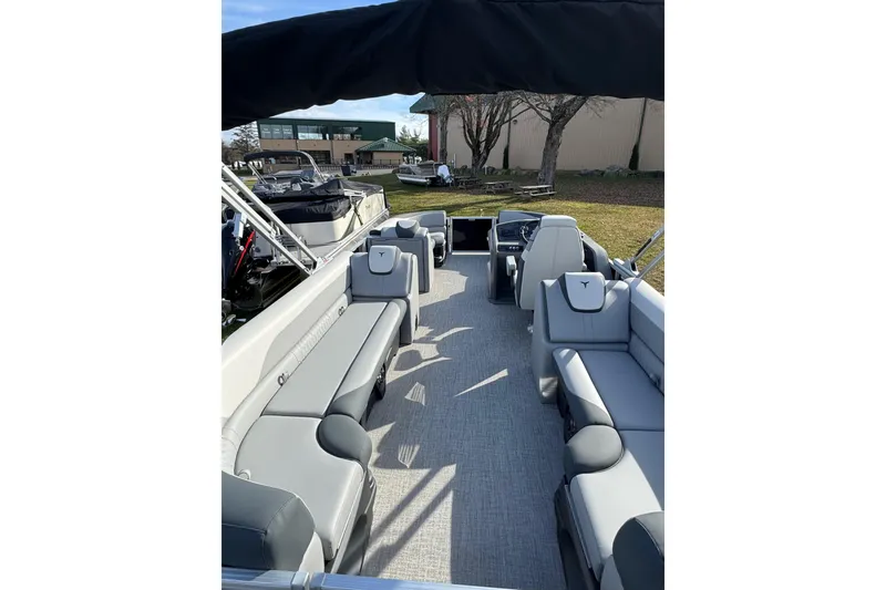 Slide: The Image of 2026 Tahoe Pontoon LTZ Quad Lounger 23 with spacious seating and modern design. - 14