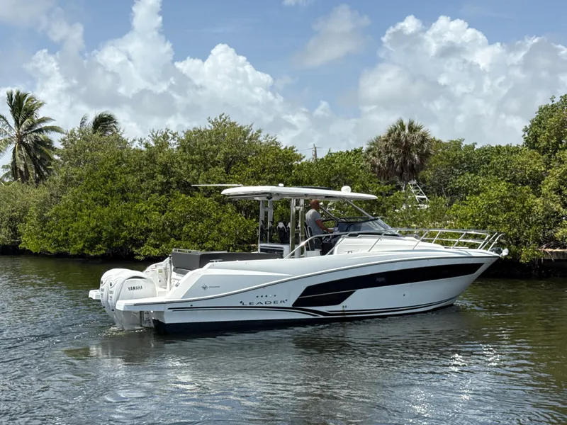 Slide: The Image of 2022 Jeanneau Leader 10.5 WA Series 2 boat cruising on a scenic waterway. - 3
