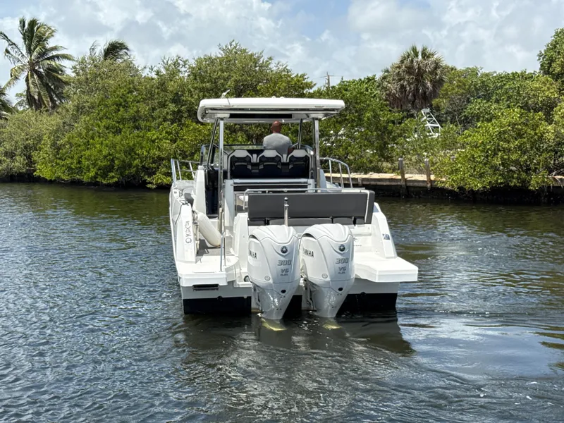Slide: The Image of 2022 Jeanneau Leader 10.5 WA Series 2 boat cruising on a calm waterway. - 5