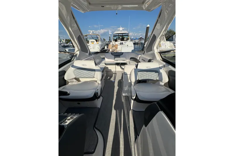 Slide: The Image of Interior view of 2021 Chaparral 317 SSX boat with luxurious seating and open deck. - 23