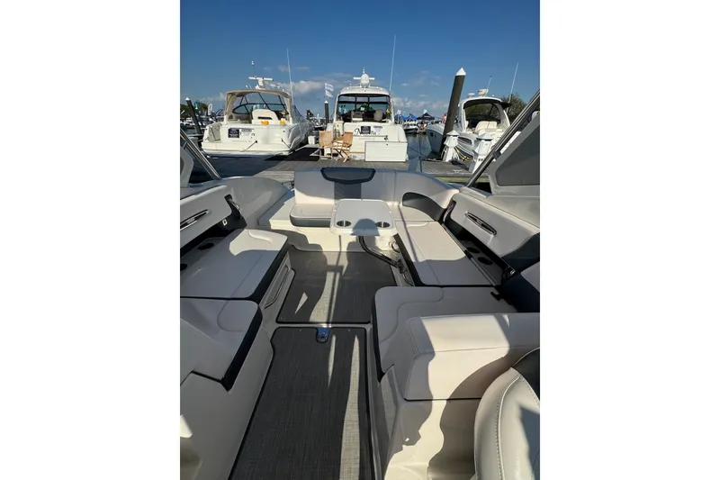 Slide: The Image of Interior view of 2021 Chaparral 317 SSX boat docked at marina. - 24