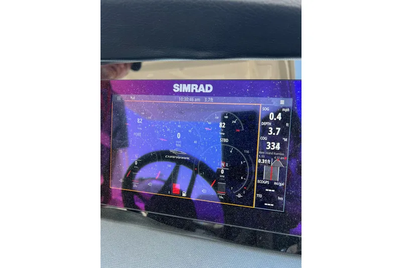 Slide: The Image of Simrad display on 2021 Chaparral 317 SSX showing navigation and engine data. - 25
