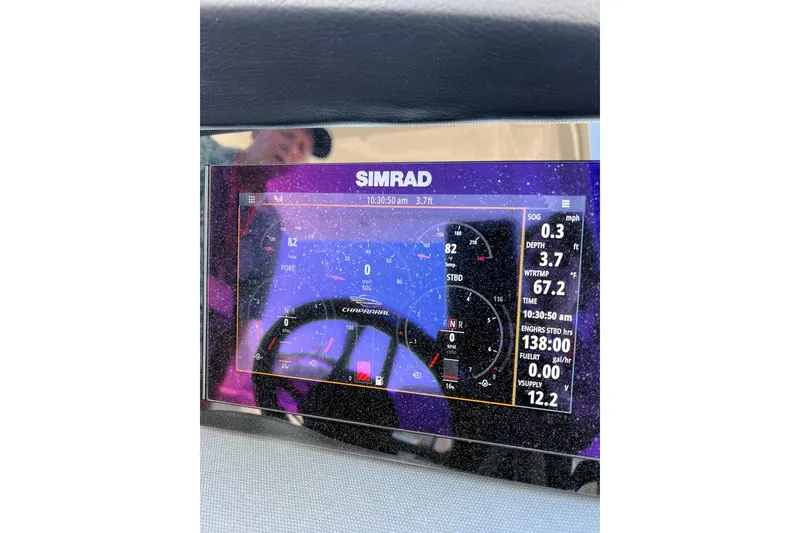 Slide: The Image of Simrad display on 2021 Chaparral 317 SSX showing navigation and engine data. - 26