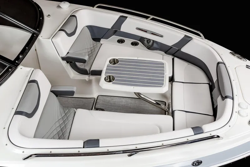 Slide: The Image of Manufacturer Provided Image: 2021 Chaparral 317 SSX boat interior with white and gray seating and table. - 30