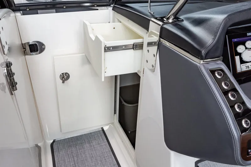 Slide: The Image of Manufacturer Provided Image: 2021 Chaparral 317 SSX boat interior storage compartment with open drawer. - 32