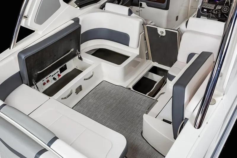 Slide: The Image of Manufacturer Provided Image: 2021 Chaparral 317 SSX boat interior with seating and storage compartments. - 35