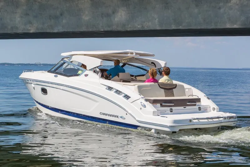 Slide: The Image of Manufacturer Provided Image: 2021 Chaparral 317 SSX boat cruising on open water with passengers. - 4