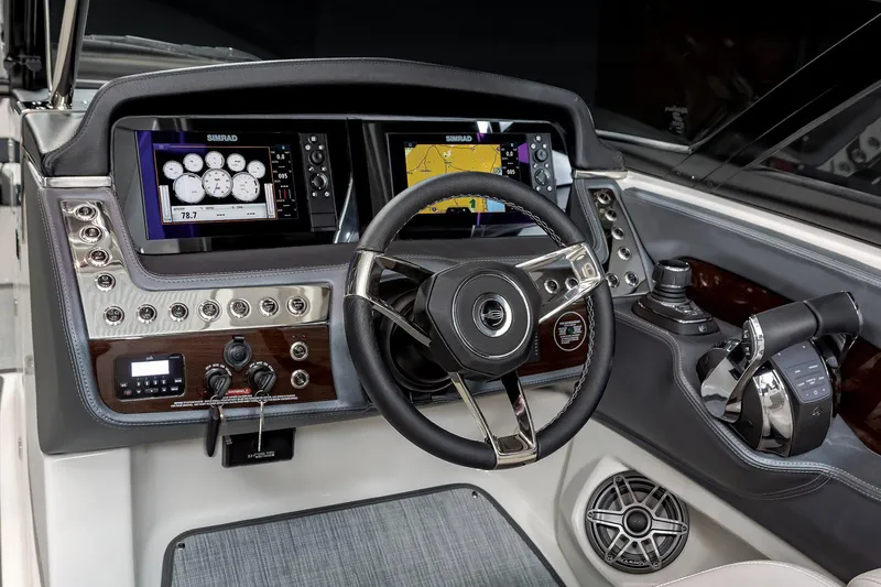 Slide: The Image of Manufacturer Provided Image: 2021 Chaparral 317 SSX boat dashboard with advanced navigation and control systems. - 8
