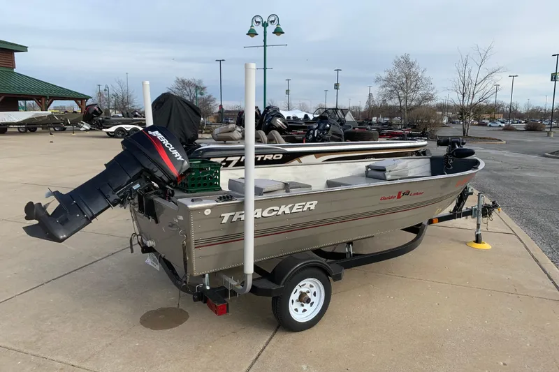 The Image of 2007 Bass Tracker Super Guide boat with Mercury outboard motor on a trailer. - 1