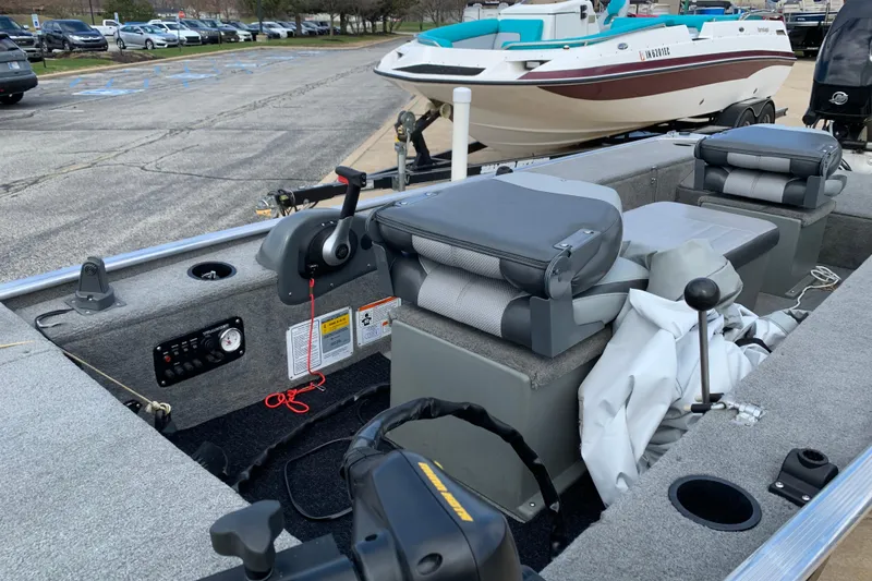 Slide: The Image of 2013 Tracker Panfish 16 boat interior with seating and control panel. - 3