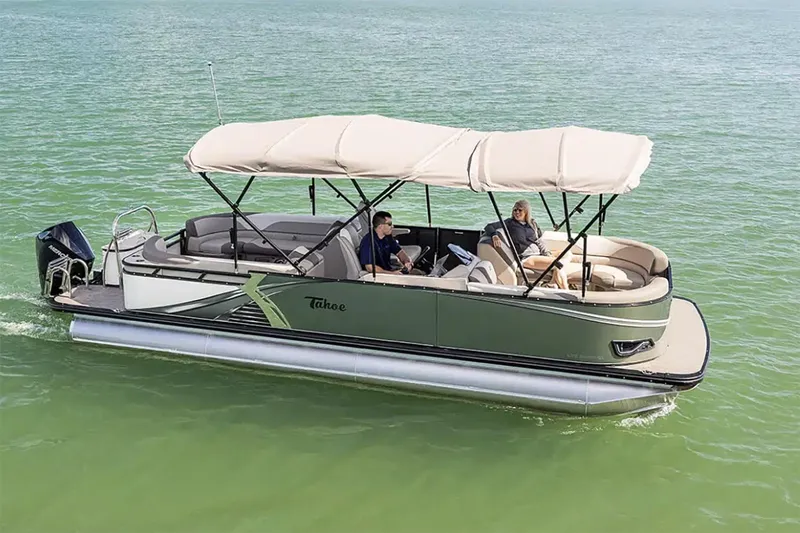 Slide: The Image of Manufacturer Provided Image: Manufacturer Provided Image: 2025 Tahoe Pontoon LTZ Quad Lounger on serene water, featuring spacious seating and canopy. - 13