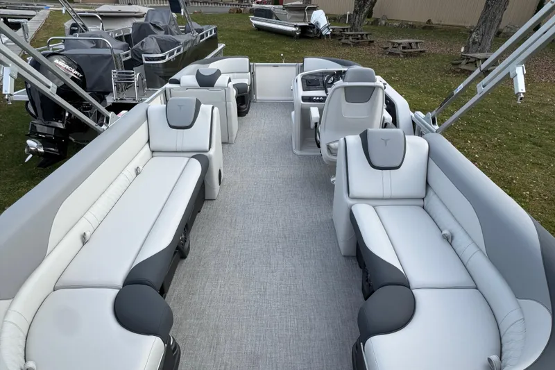Slide: The Image of 2026 Tahoe Pontoon LTZ Quad Lounger 23 with spacious seating and modern design. - 2