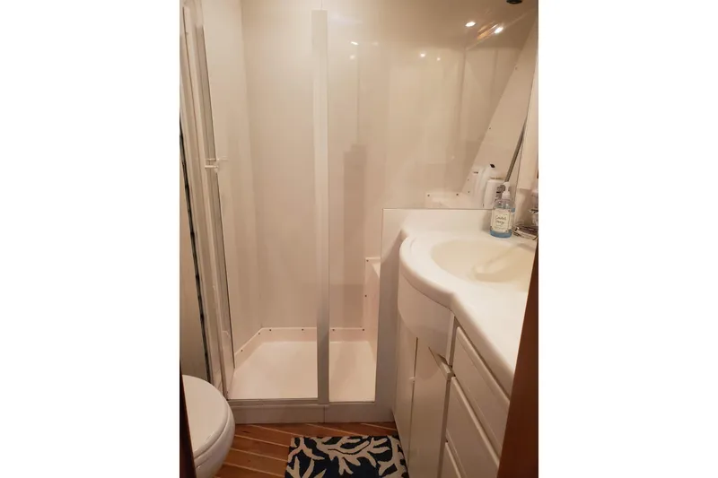 Slide: The Image of Bathroom interior of 1996 Bertram 46 Convertible yacht with shower and sink. - 16