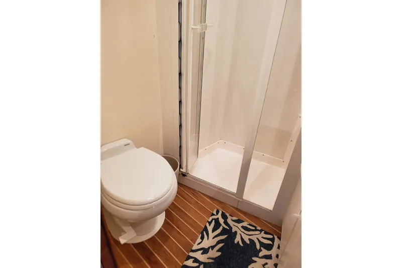 Slide: The Image of Bathroom interior of 1996 Bertram 46 Convertible yacht with shower and toilet. - 18
