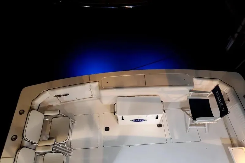 Slide: The Image of Bertram 46 Convertible 1996 boat deck with chairs and blue lighting. - 25