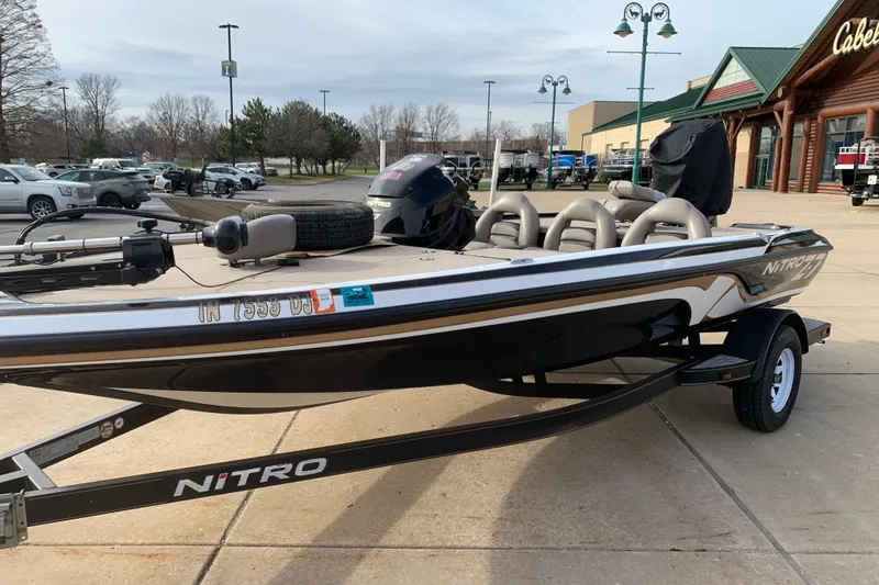 Slide: The Image of 2010 Nitro Z-7 boat on trailer outside Cabela's store. - 2