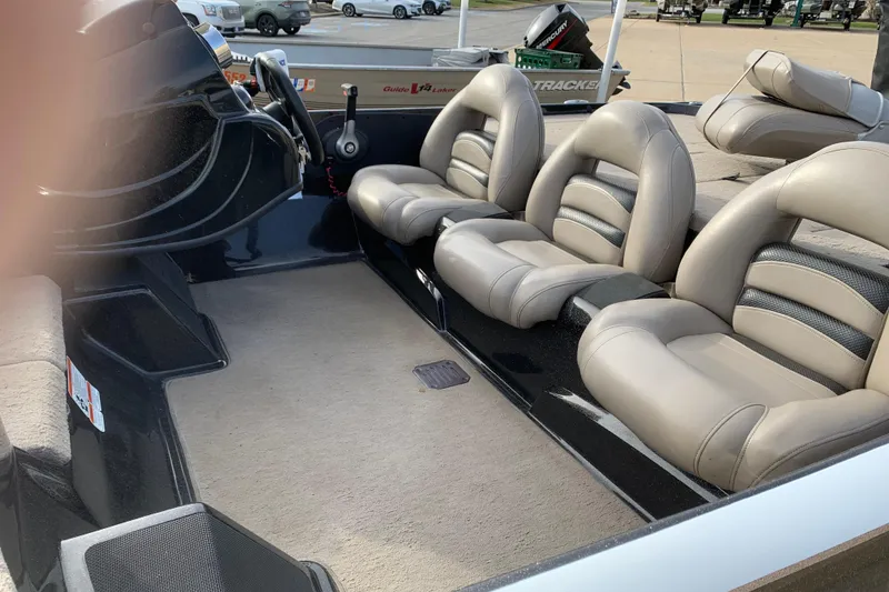 Slide: The Image of Interior of a 2010 Nitro Z-7 boat with beige leather seats. - 3