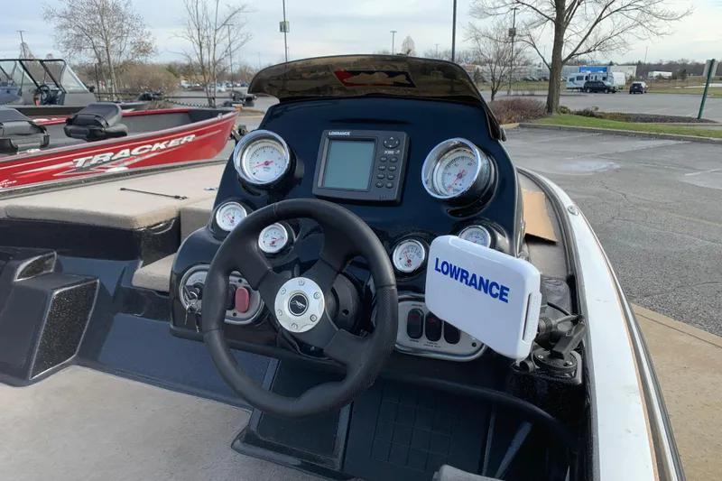 Slide: The Image of 2010 Nitro Z-7 boat dashboard with Lowrance electronics and steering wheel. - 4