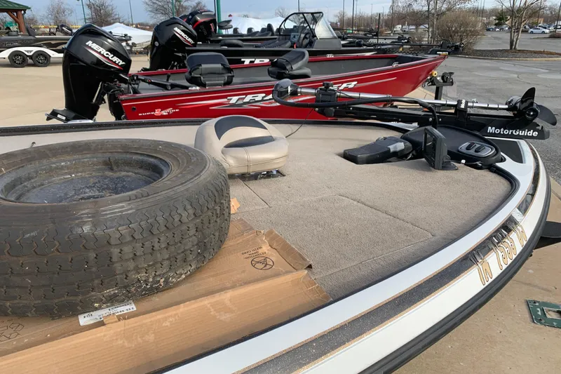 Slide: The Image of 2010 Nitro Z-7 boat with spare tire and MotorGuide trolling motor on deck. - 5