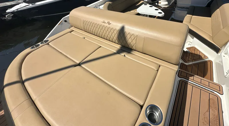 Slide: The Image of 2019 Sea Ray SLX 280 boat with tan leather seating and cup holders. - 37