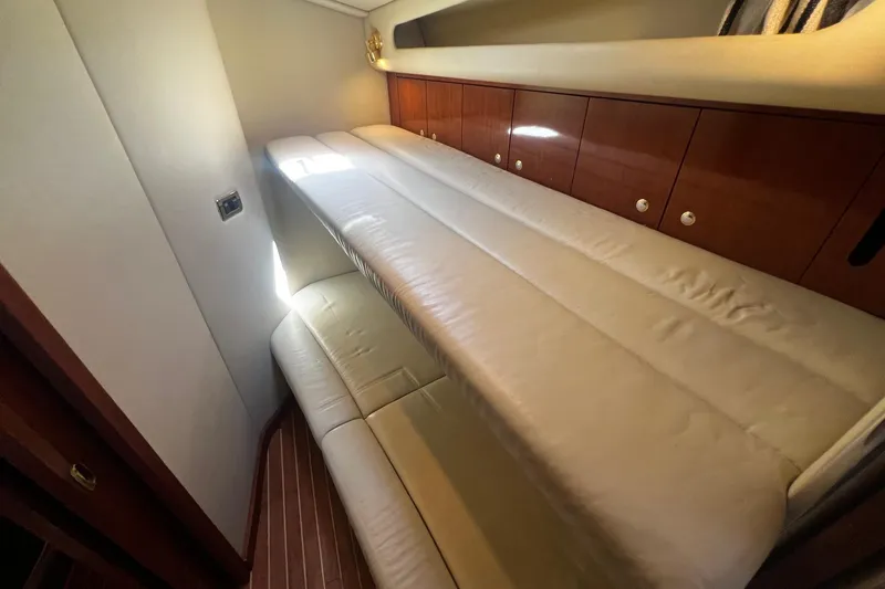 Slide: The Image of Luxurious cabin interior of 2003 Sea Ray 410 Express Cruiser with plush seating. - 23