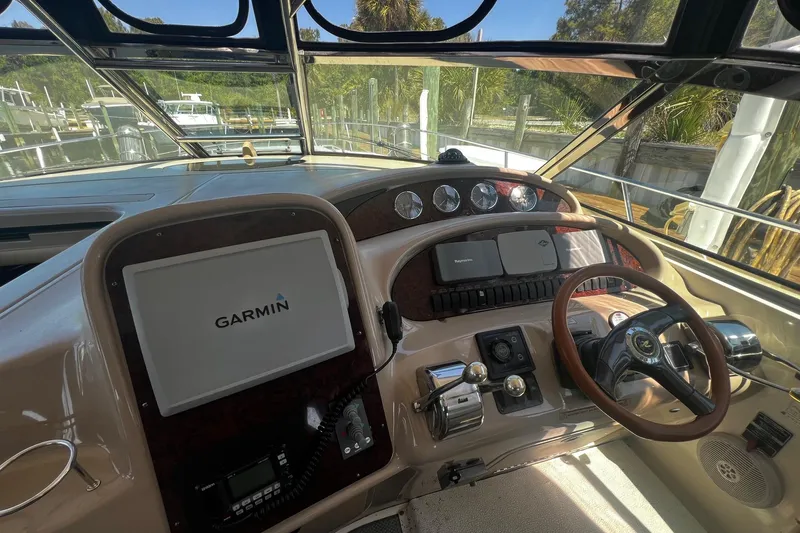 Slide: The Image of Cockpit of 2003 Sea Ray 410 Express Cruiser with Garmin navigation system. - 27