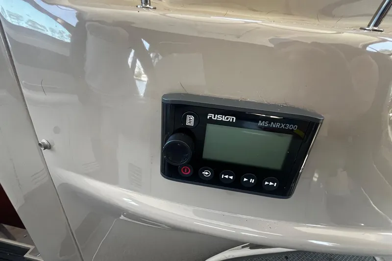 Slide: The Image of Fusion MS-NRX300 stereo control on 2003 Sea Ray 410 Express Cruiser dashboard. - 31