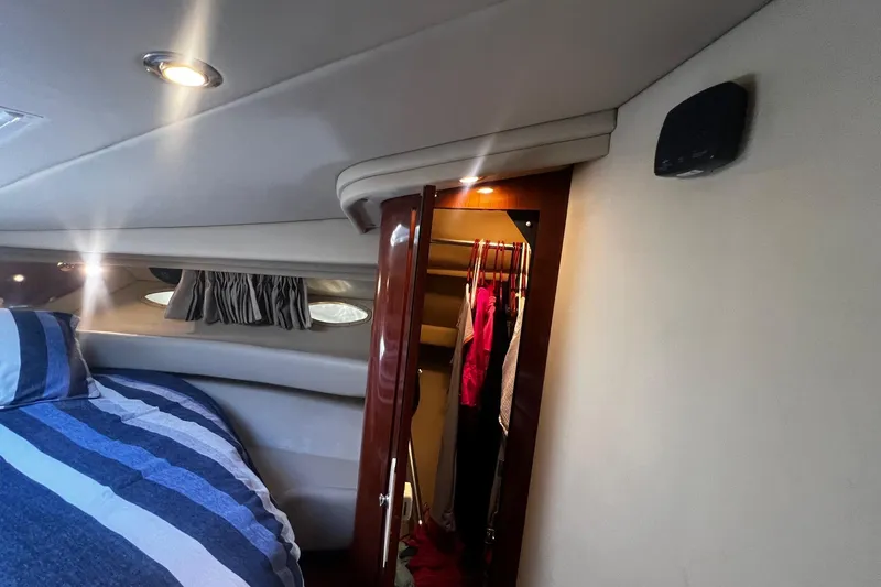 Slide: The Image of Interior of 2003 Sea Ray 410 Express Cruiser with cozy cabin and closet space. - 41