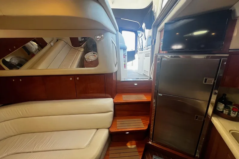 Slide: The Image of Interior of 2003 Sea Ray 410 Express Cruiser with luxurious seating and modern amenities. - 42