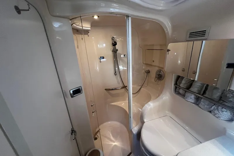 Slide: The Image of Luxurious bathroom in 2003 Sea Ray 410 Express Cruiser yacht, featuring shower and modern amenities. - 43