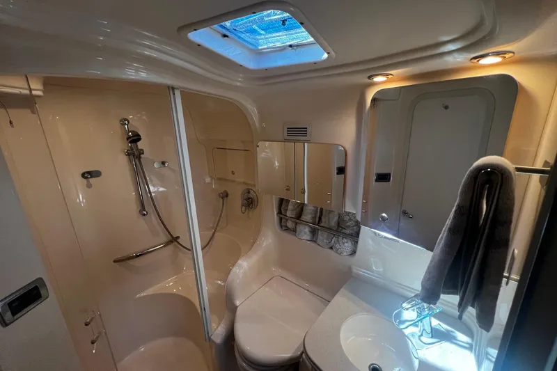Slide: The Image of Luxurious bathroom in 2003 Sea Ray 410 Express Cruiser with shower and skylight. - 44