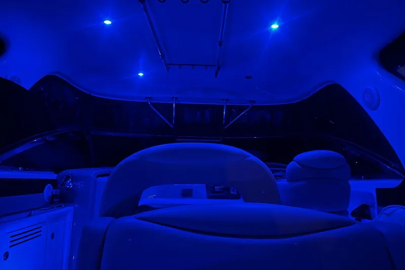Slide: The Image of Interior of 2003 Sea Ray 410 Express Cruiser with blue ambient lighting. - 48