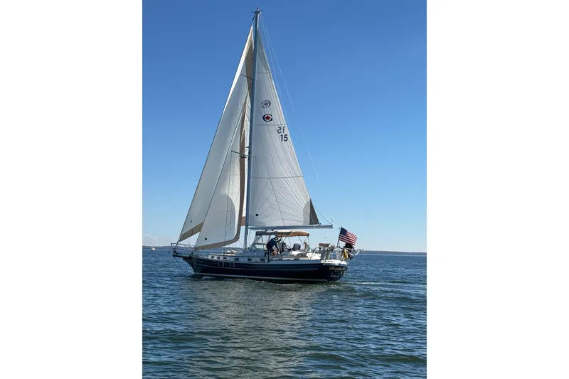 The Image of Sailing yacht Gozzard 44 Center Cockpit, 1998 model, cruising on open water under clear skies. - 0