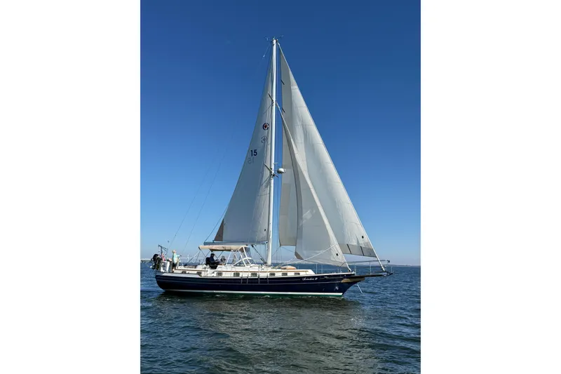 Slide: The Image of Sailing on open water, 1998 Gozzard 44 Center Cockpit yacht with full sails under clear blue sky. - 2