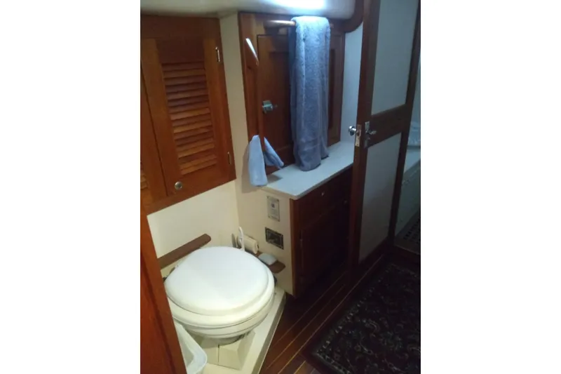 Slide: The Image of Bathroom interior of 1998 Gozzard 44 Center Cockpit yacht with wooden cabinetry. - 7