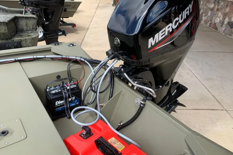 Slide: The Image of 2026 Tracker Grizzly 1754 SC boat with Mercury outboard motor and DieHard battery. - 4